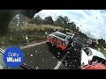 Terrifying moment a multi-truck crash almost wipes out highway police car