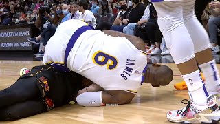 LeBron James and Duncan Robinson fighting for a loose ball 💪