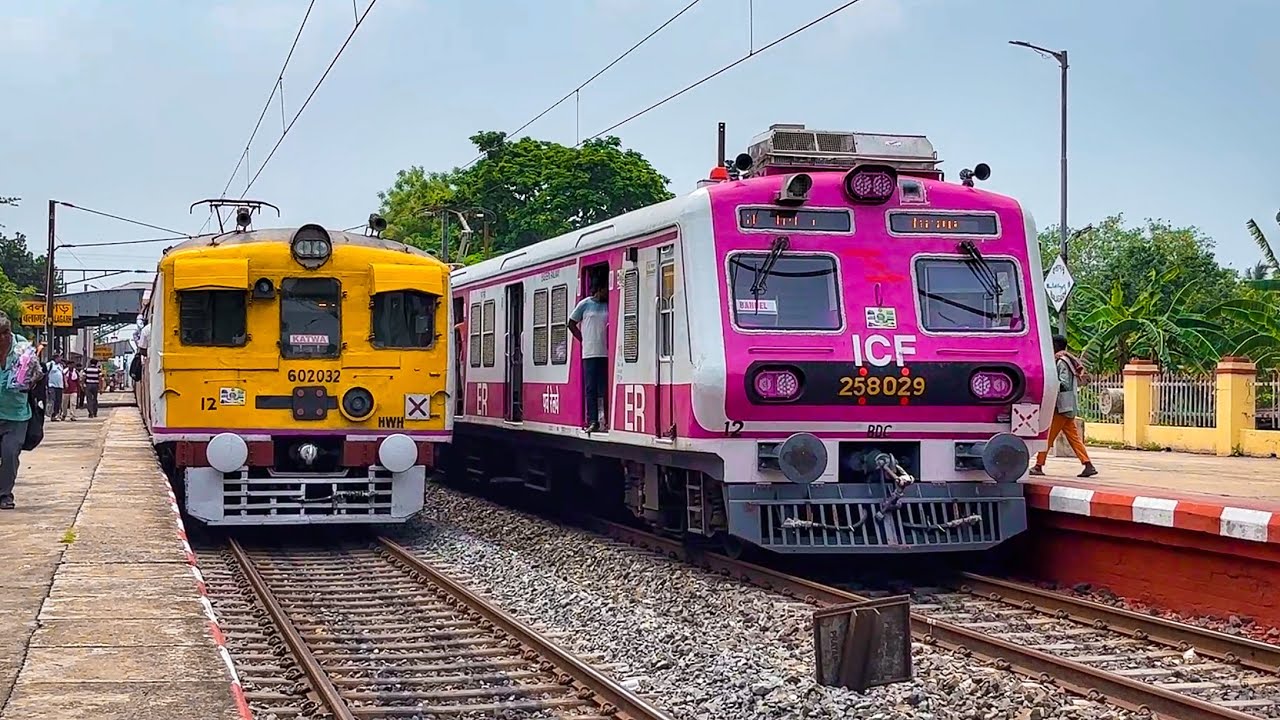 Old vs New train crossing! Pink and Yellow colour EMU Local train perfect crossing.