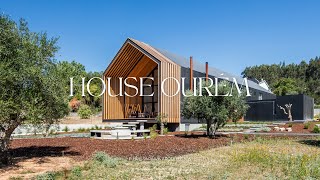 Modern Family House Design With Black Concrete Panels on a Slightly Sloped Piece of Farmland