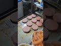 Cooking Big Italian Burgers on Grill. Italy Food Fair