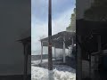 Giant wave catches everyone off guard! 🏃‍♂️💨 #viral