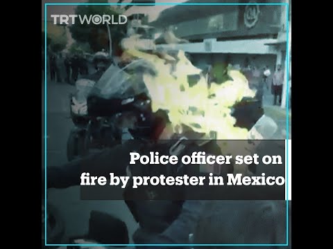 Police officer set on fire by protester in Mexico