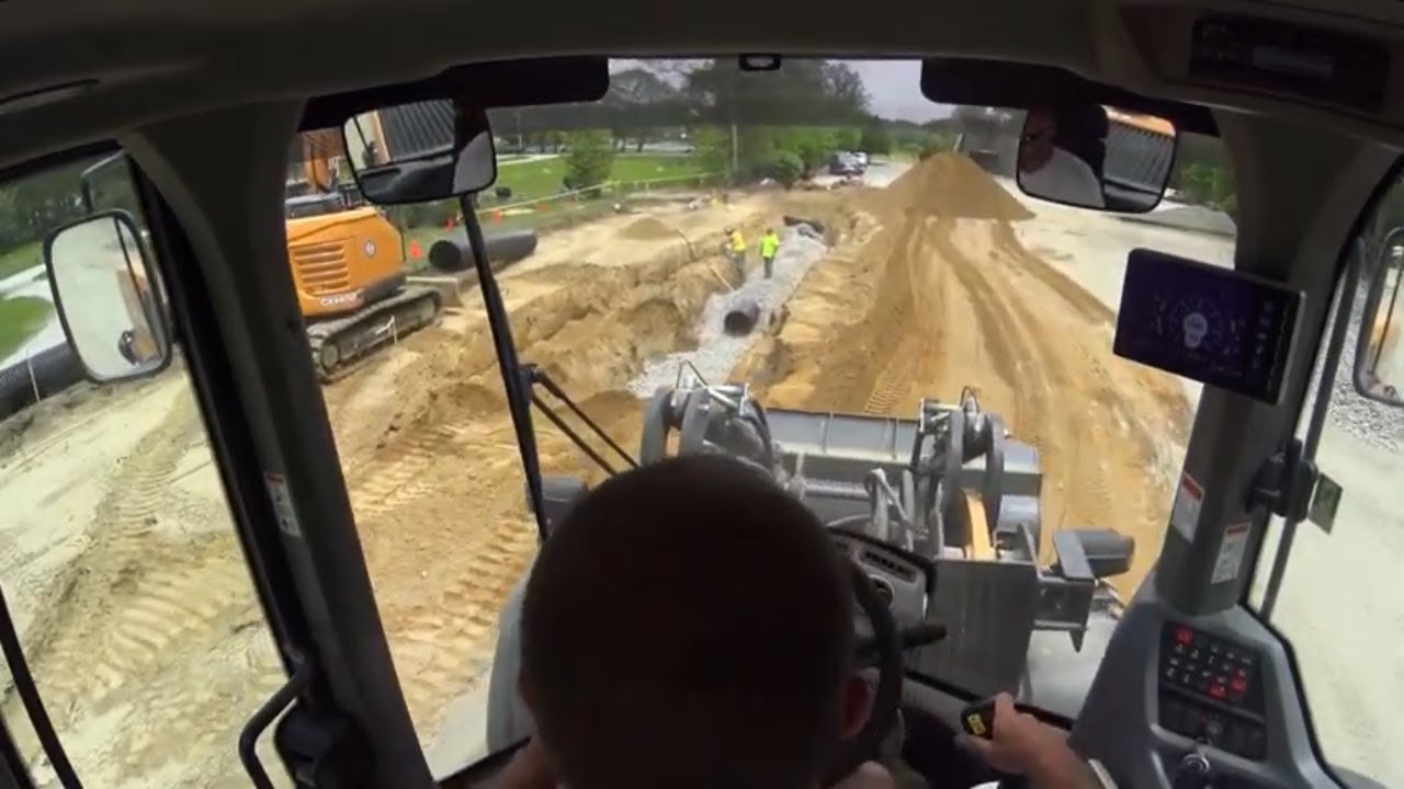 621GXT Front Loader Loading Dump Truck and Back Filling Pipe - In Cab View | Parking Lot Expansion