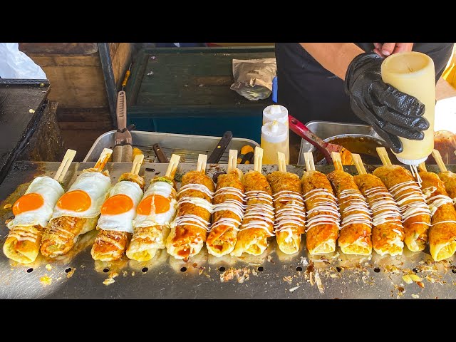 japanese street food - hashimaki はしまき okonomiyaki on a chopstick