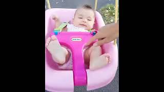 Woman swings baby on swing set and finds her son flipped on side with toy car