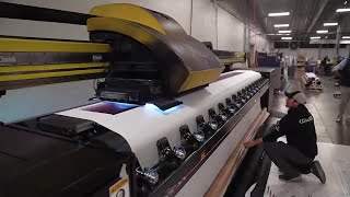 Elmwood print shop produces Super Bowl LIX signs, banners and enormous building wraps