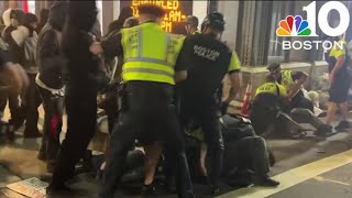 13 people from violent rally with Boston police due in court