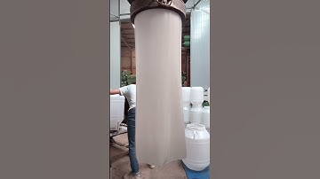 Hard-working workers process plastic barrels
