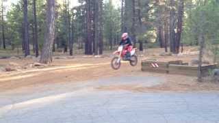 Dirt bike jumping off loading dock