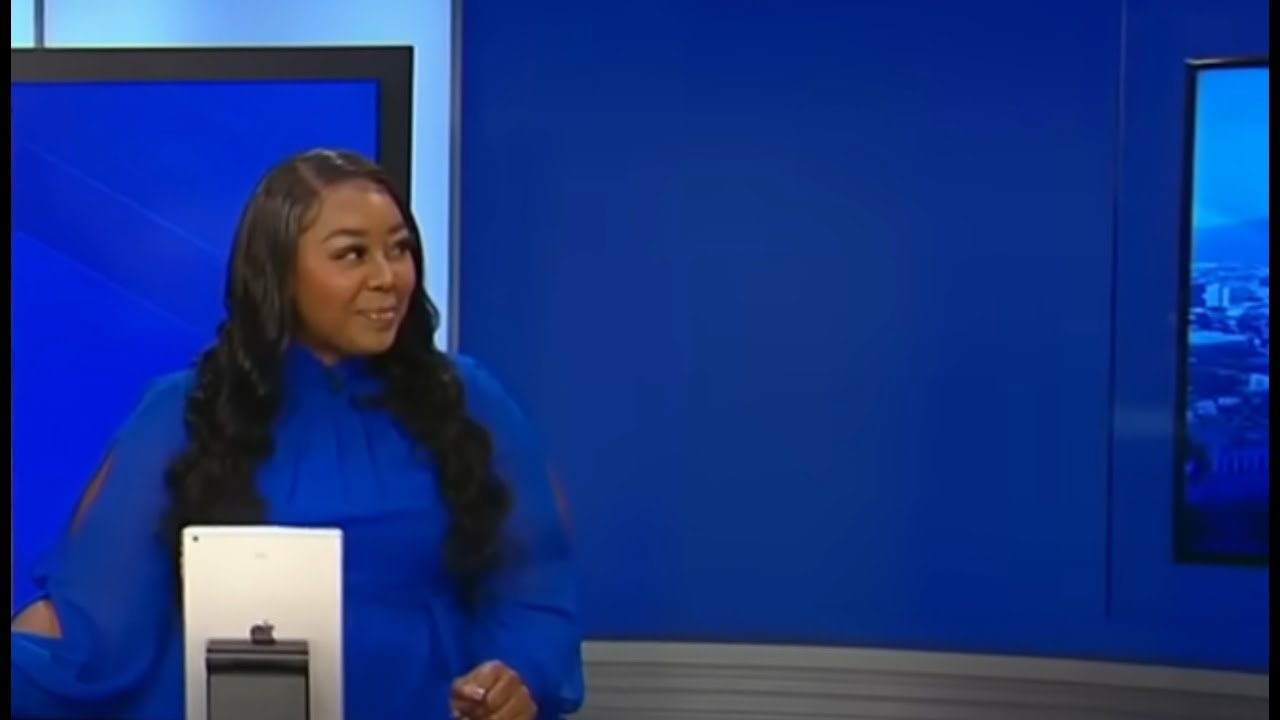 Black female news anchor is interrupted when a creepy white guy runs onto the set.