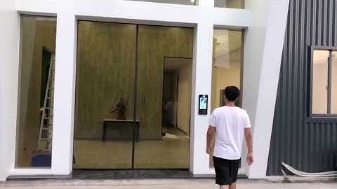 Facial recognition automatic sliding door. Idea for company main entrance. Linear magnetic drive