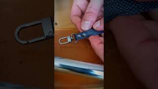 Closing a hand strap for a zipper pouch. Leathercraft