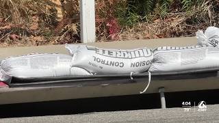 Why are sandbags placed around San Luis Obispo