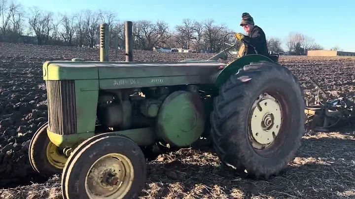John Deere R plowing with 4 bottom plow