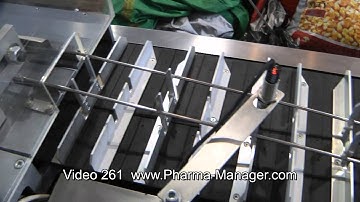 Cartoning Machine for packaging of vials in PVC containers. Video 261 www.Pharma-Manager.com