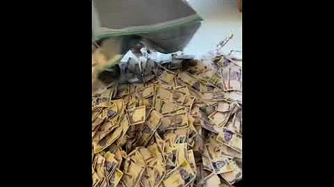 Nigeria Crossdresser Bobrisky shows off monies sprayed on him at his birth party.