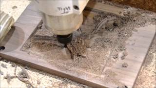 Making a Cardinal inlay on a cutting board using a CNC. The board is cherry and the inlay is walnut. The CNC used is a Laguna 