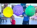 Anto and Jun play with colorful balloons. surprise inside the balloons when they are pierced