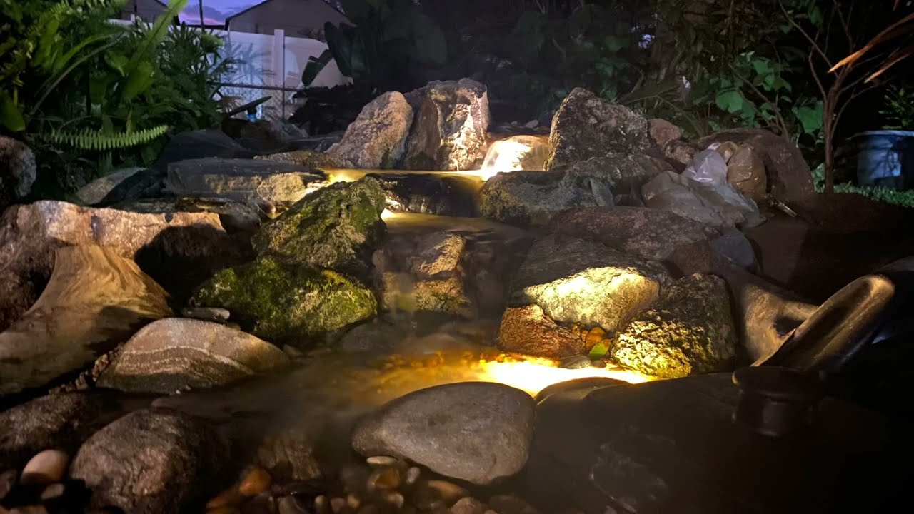 Small preformed pond converted to a 10 ft pondless waterfall and stream.