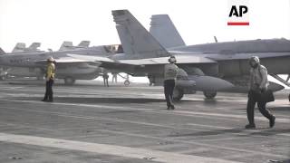 Video released by the U.S. Navy shows F/A-18 Hornets and EA-6B Prowlers returning to and launching f