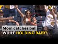Mom Catches Foul Ball While HOLDING BABY At Baseball Match !