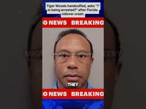Tiger Woods handcuffed, asks "T'm being arrested?" after Florida rollover crash.