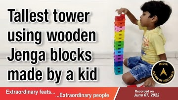 Tallest tower using wooden Jenga blocks made by a kid
