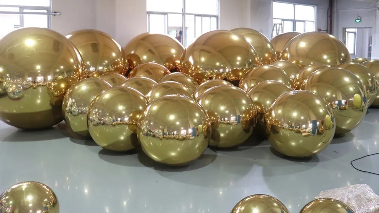 Big shiny gold mirror balls for birthday, wedding, corporate milestone events backdrop decoration