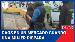 Edicion Digital: caos en un mercado cuando una mujer dispara contra el guardia que la detiene