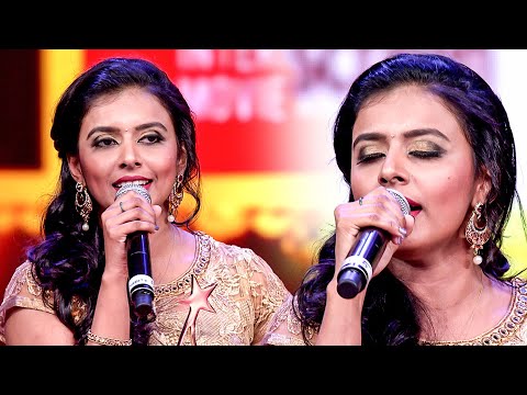 Sithara mesmerizes the audience with her enchanting rendition of a classical song on the stage