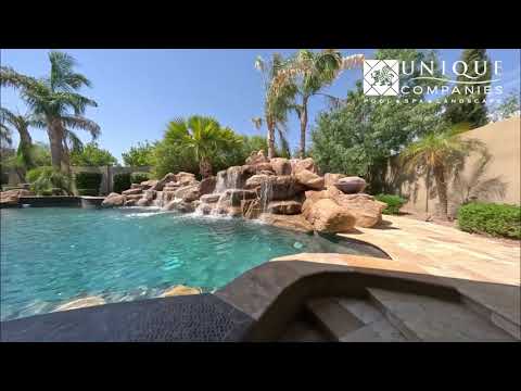 Turn Your Backyard Into a Resort | Pool with Rock Waterfall & Spa Design