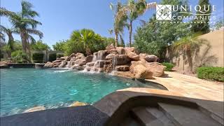Turn Your Backyard Into a Resort | Pool with Rock Waterfall & Spa Design