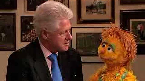 President Clinton and Muppet Kami share HIV/AIDS m...