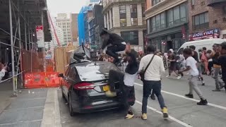 Social media influencer charged with inciting riot after thousands cause mayhem in NYC