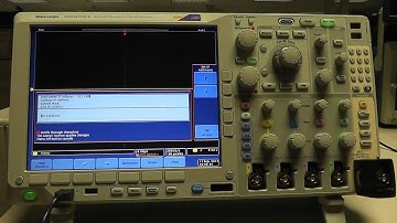 How do I configure the LAN Settings on an MDO4000 series oscilloscope?