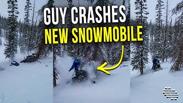 Guy  Crashes His Brand New Snowmobile Into a Tree