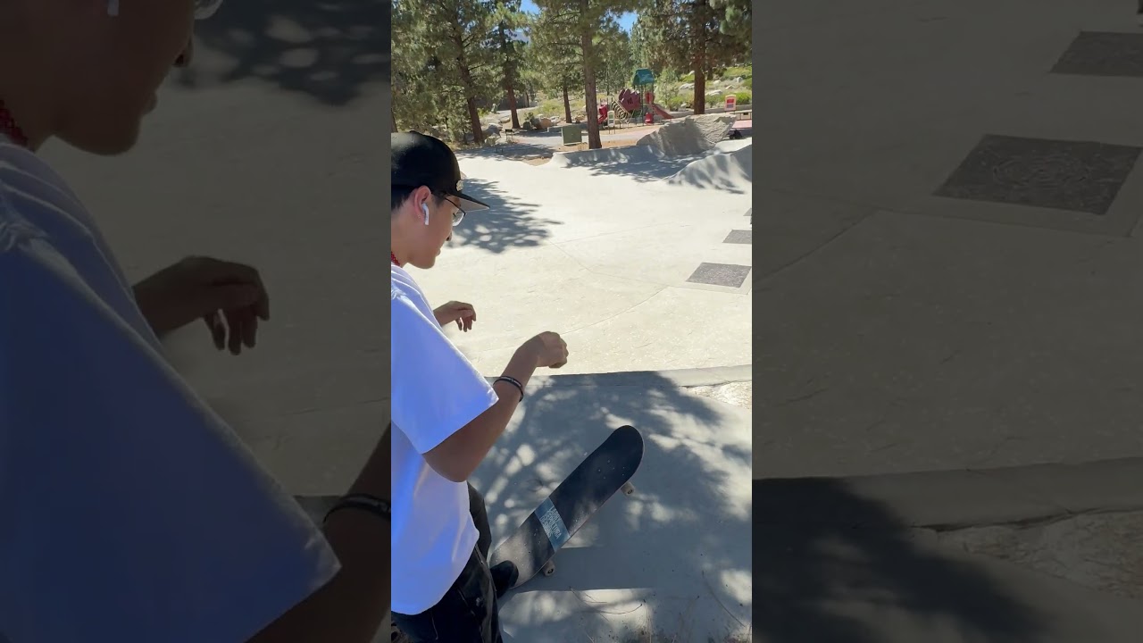 Skateboarder 50 50 grinds spine of ramp then falls and lands on sensitive area (Angle 2)