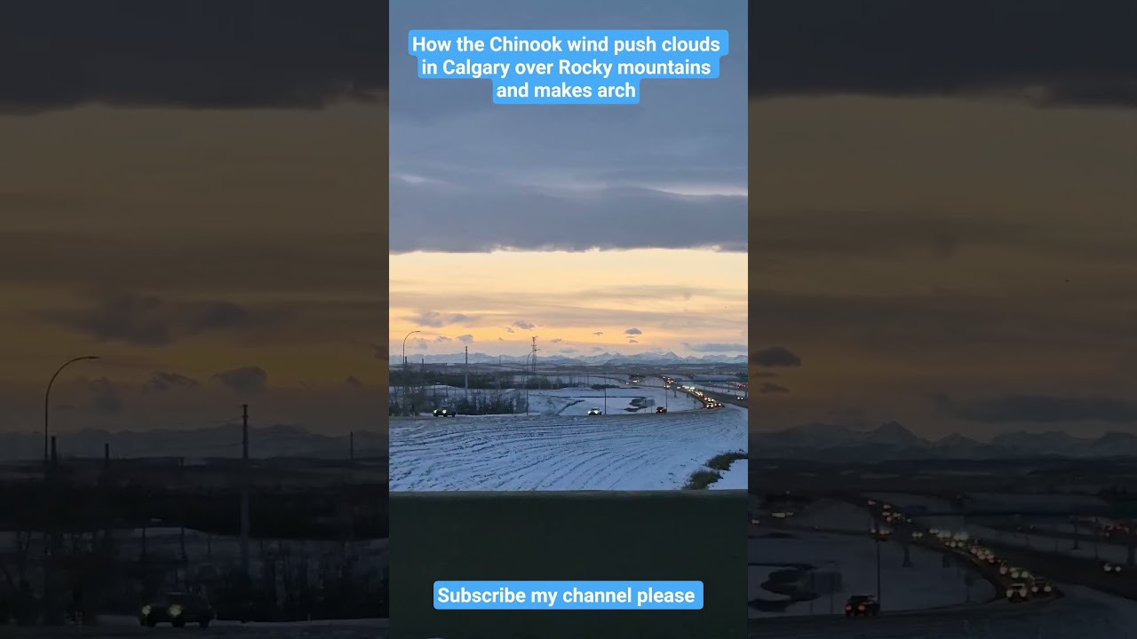 Chinook  wind making arch over Rocky mountains of Calgary 