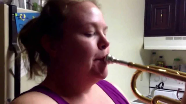 My mom trying to play my trumpet