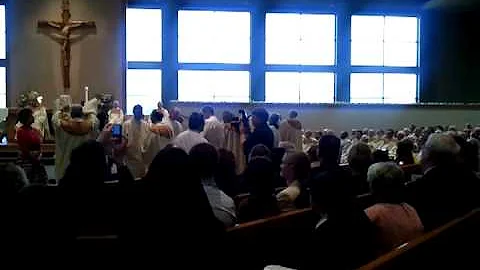 Richard Harden is vested in stole and dalmatic