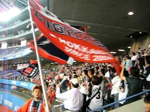 This is one of the Nippon Ham Fighters "chance themes", which are special songs sung during situations when the team is more likely to score a run. However, this particular film is of the ouendan at the Osaka Dome, on Oct 12th, AFTER the game had ended. The Fighters won the first stage of the Pacific League playoffs, so all the fans were staying after the game to practice the cheer music in order to sing it better at the second stage of the playoffs. This chance theme is called "jingiskan", or "Genghis Khan", and is supposedly the Sapporo-only chance theme, but it seems to make its way into other stadiums around Japan from time to time as well. Jingiskan is a kind of grilled lamb that people eat in Hokkaido, it's pretty famous, so it makes people think of Hokkaido and the Fighters. We were practicing the theme with Inaba as the player.