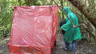 Solo camping in heavy rain, using plastic bags