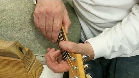 How to Fix a Ringing Guitar String : Guitar Building & Repair