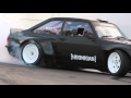 Hoonigan ken block slays tires in the gymkhana escort at the donut garage