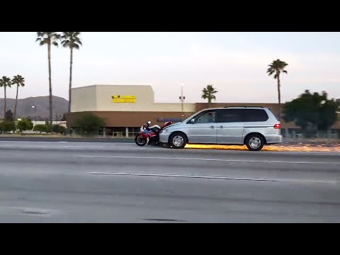 Van Driver Hits Motorcycle and Drags it Along on Highway