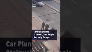 Car Plunges Into Stairwell, Two People Narrowly Escape