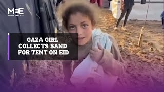 A young girl in Gaza spends Eid collecting sand for her muddy tent