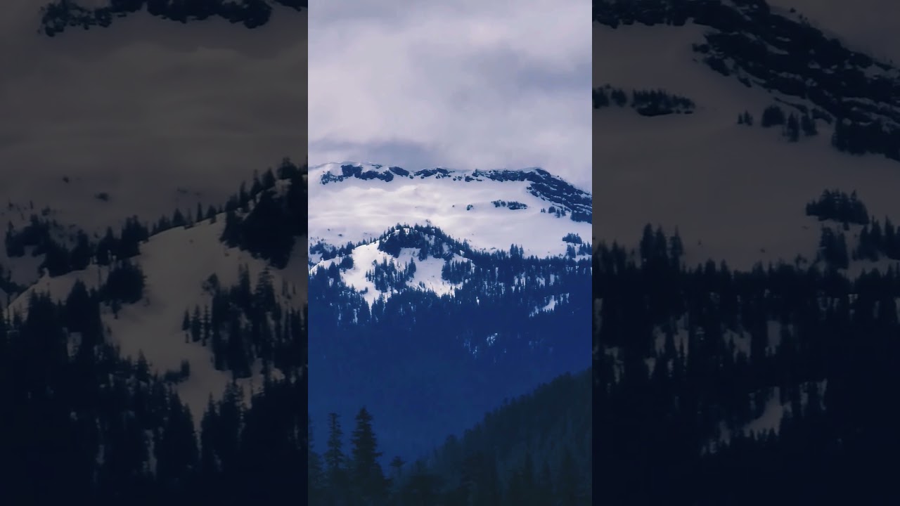 Snow covered mountain peaks. 