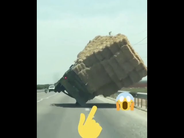Overloaded truck fall down class=